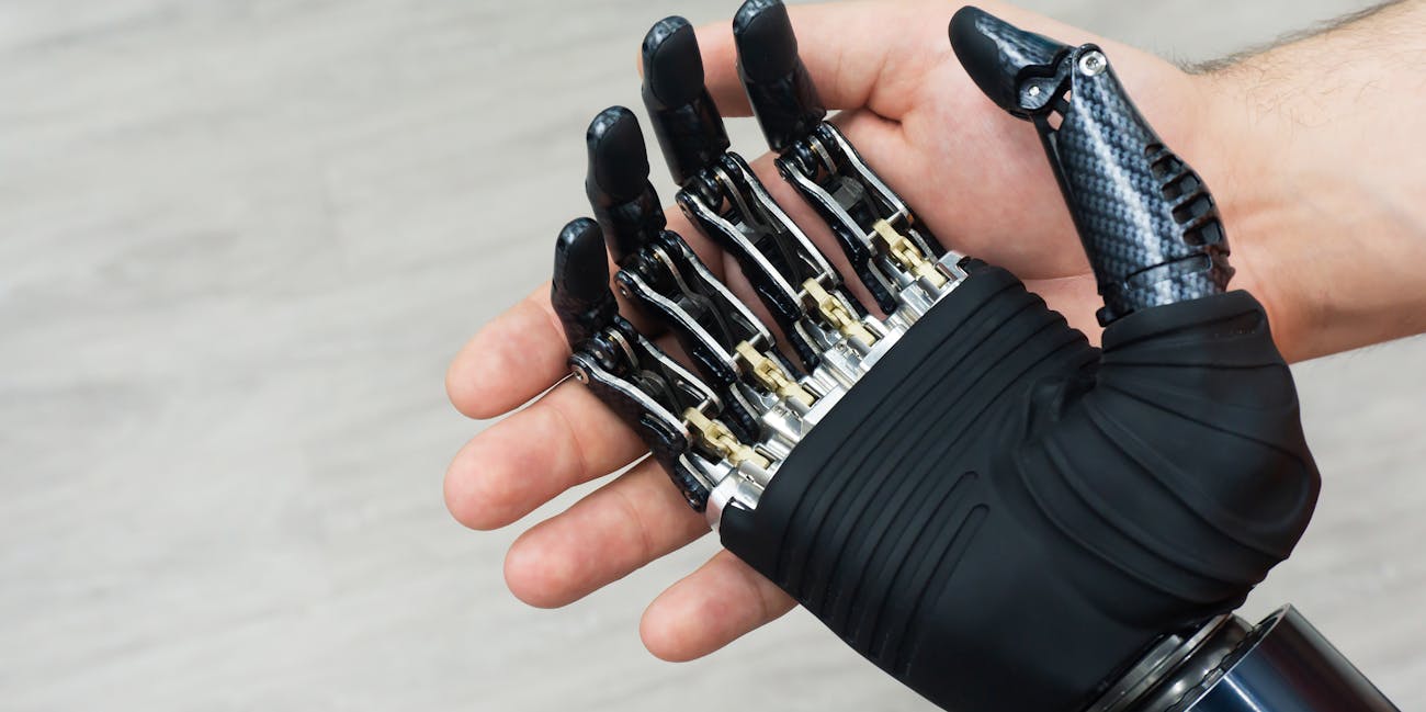 Robot hand in human hand