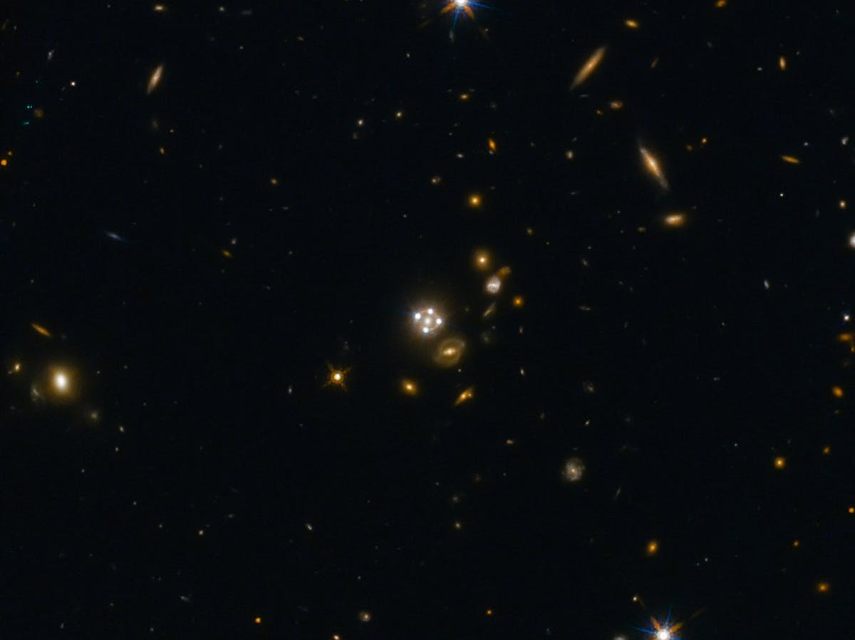Lensed quasar and its surroundings