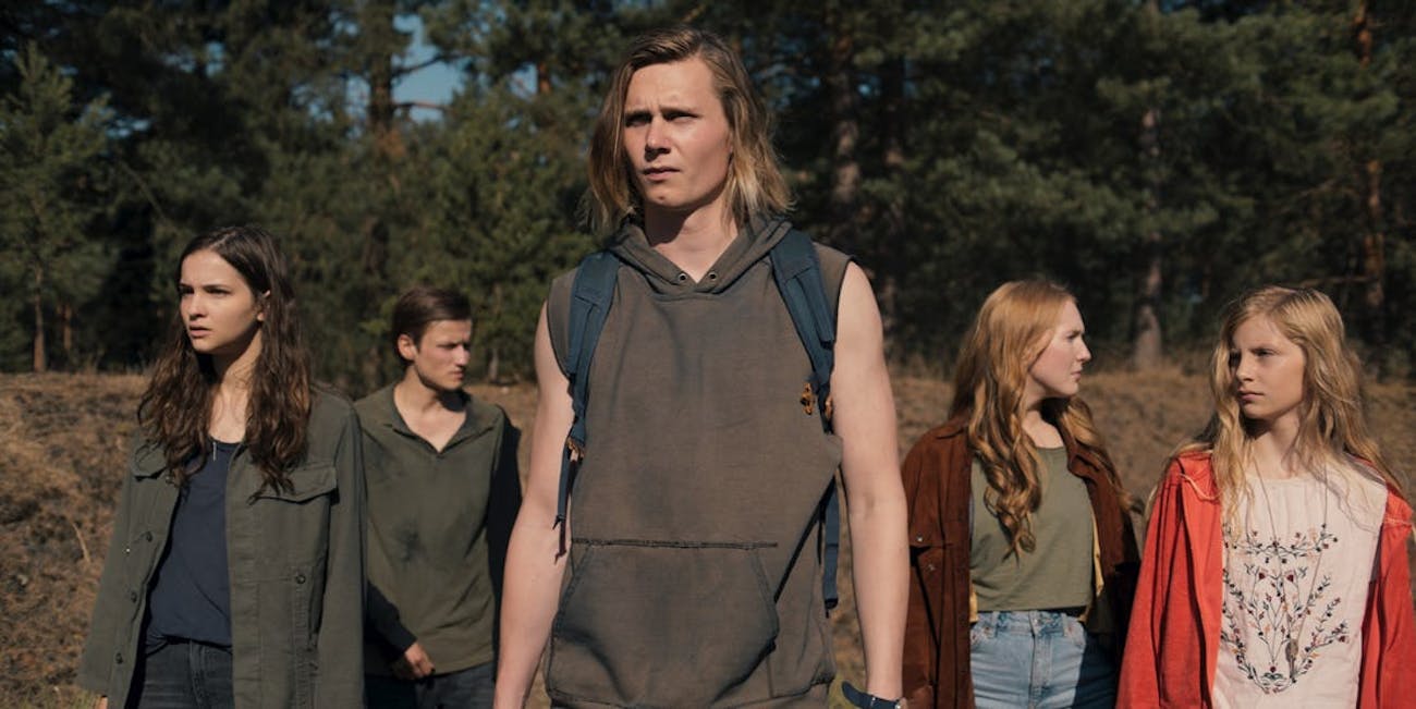 The cast of Netflix's Dark in a still showing them traveling from 2020 to 1987