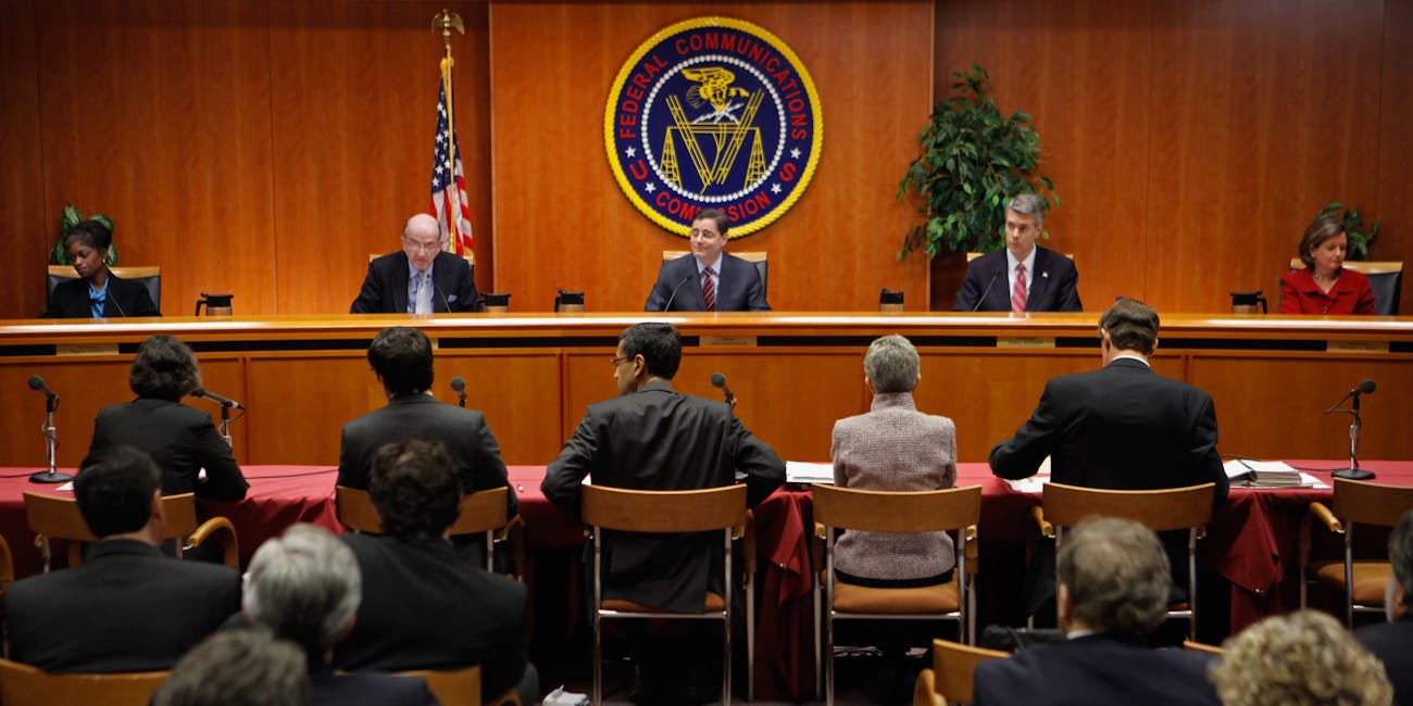 WASHINGTON, DC - DECEMBER 21: Federal Communications Commission Commissioners (L-R) Mignon Clyburn, Michael Copps, Chairman Julius Genachowski, Robert McDowell and Meredith Attwell Baker deliver opening remarks before they voted 3-2 to adopted controversial Net neutrality rules December 21, 2010 in Washington, DC. The rules put into effect by the commission create two different classes of broadband internet service -- one for fixed networks and another for wireless networks -- due to their technological differences. (Photo by Chip Somodevilla/Getty Images)