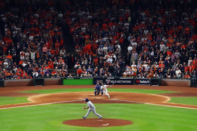 HOUSTON, TX - OCTOBER 30: Alex Bregman #2 of the Houston Astros hits a game-winning single during the tenth inning against Kenley Jansen #74 of the Los Angeles Dodgers in game five of the 2017 World Series at Minute Maid Park on October 30, 2017 in Houston, Texas. (Photo by Ezra Shaw/Getty Images)