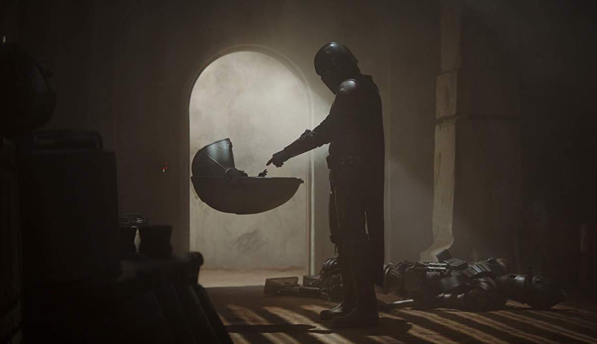 Baby Yoda and The Mandalorian meet in 'The Mandalorian' on Disney Plus