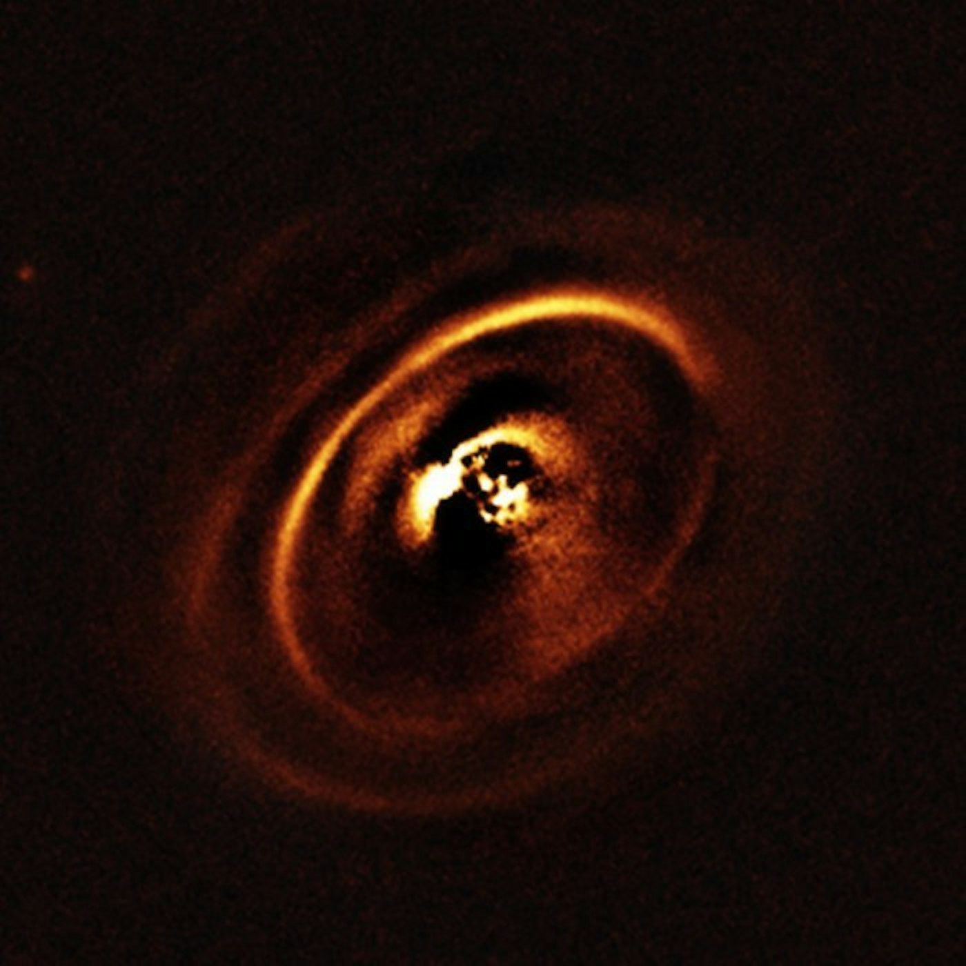 Concentric rings on the disk around the star RX J1615.