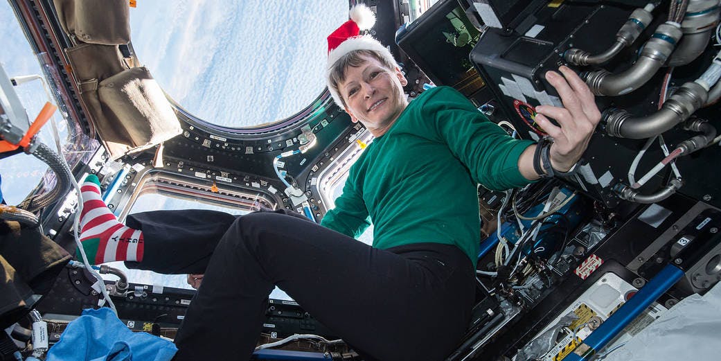 NASA's Peggy Whitson poses for a festive picture in the cupola.