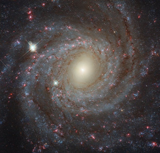 This image of the spiral galaxy NGC 3344, located about 20 million light-years from Earth, is a composite of images taken through seven different filters.