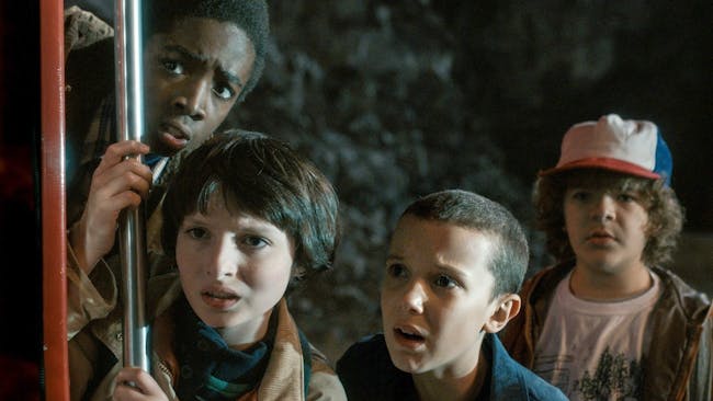 From L-R: Lucas, Mike, Eleven, and Dustin on 'Stranger Things'.