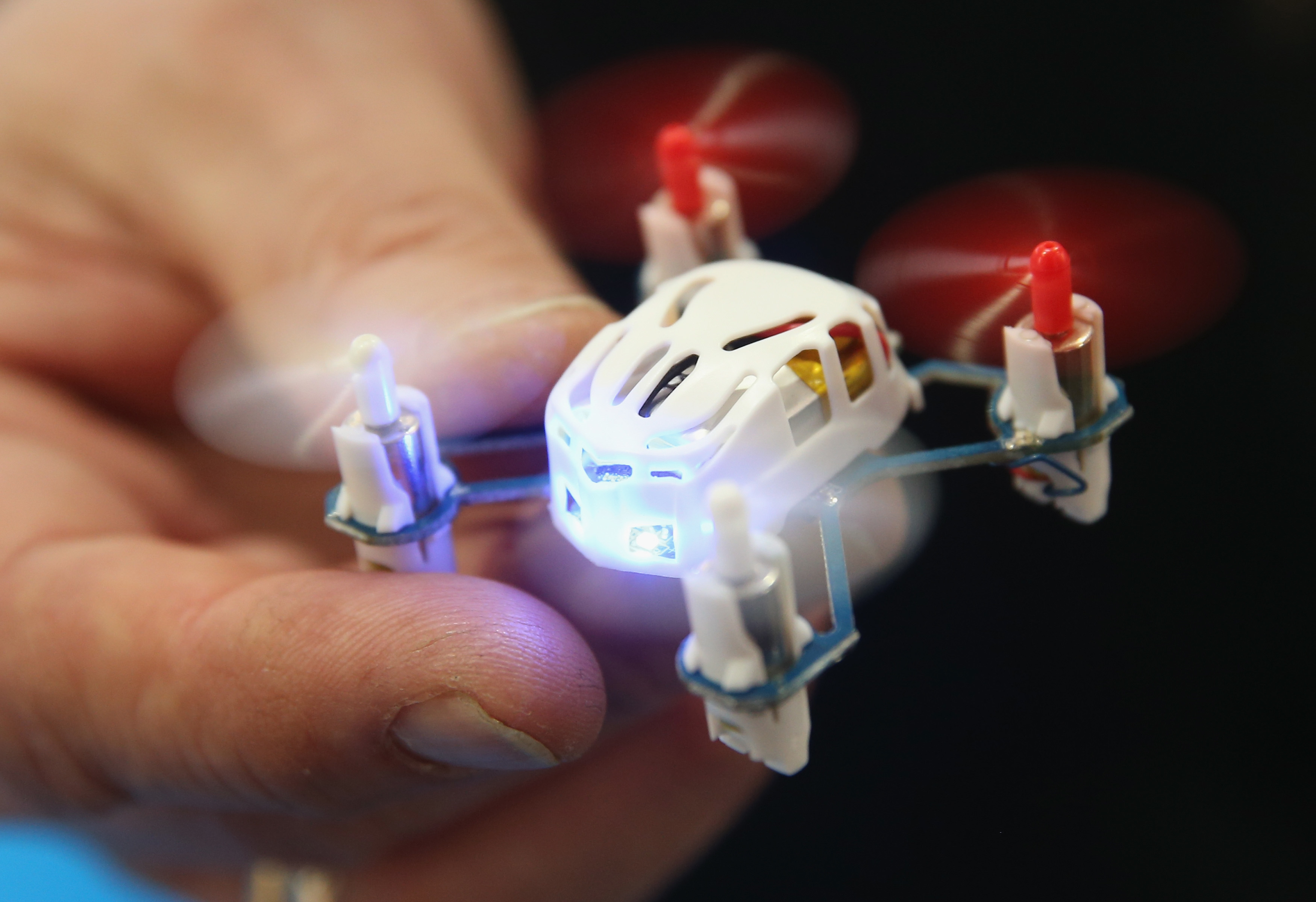The tiny drones are coming: Here a stand host holds a QH micro quadcopter drone by Chinese manufacturer Lian Sheng at the 2015 CeBIT technology trade fair on March 16, 2015 in Hanover, Germany.