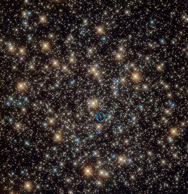 A star that has been found to be orbiting a black hole with four times the mass of the Sun is indicated with blue circle.