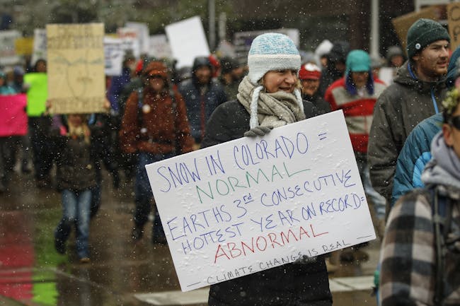 Thousands of protestors march around downtown Denver at the People's Climate March on Denver on April 29, 2017 in Denver, Colorado. The protest, which focused on climate change, coincided with President Donald Trump's 100th day in office. (Photo by Marc Piscotty/Getty Images)
