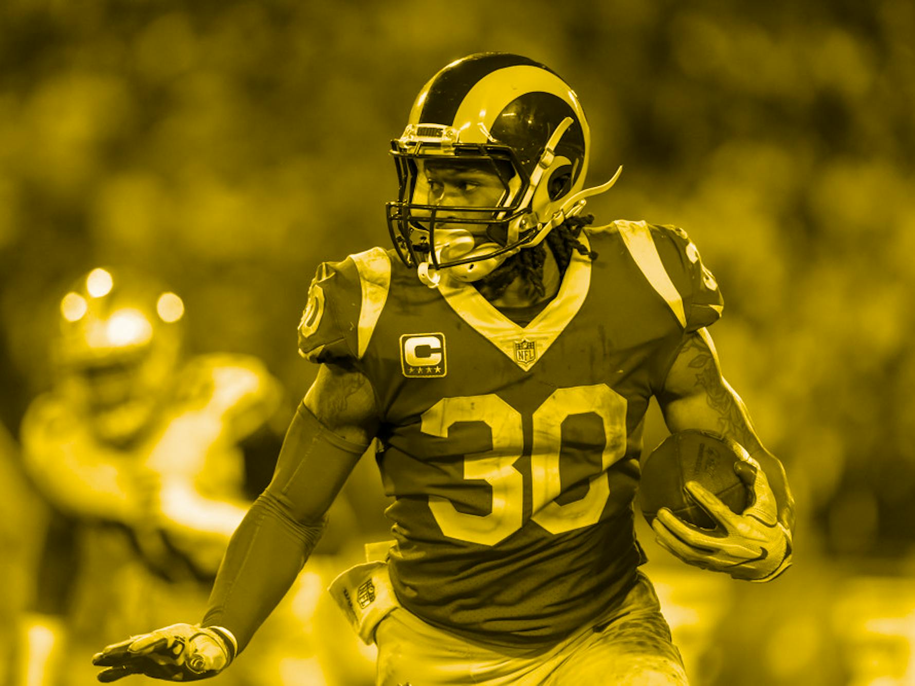 Los Angeles Rams running back Todd Gurley (30) runs for a gain during the NFC Divisional Football game between the Dallas Cowboys and the Los Angeles Rams on January 12, 2019 at the Los Angeles Memorial Coliseum in Los Angeles, CA.