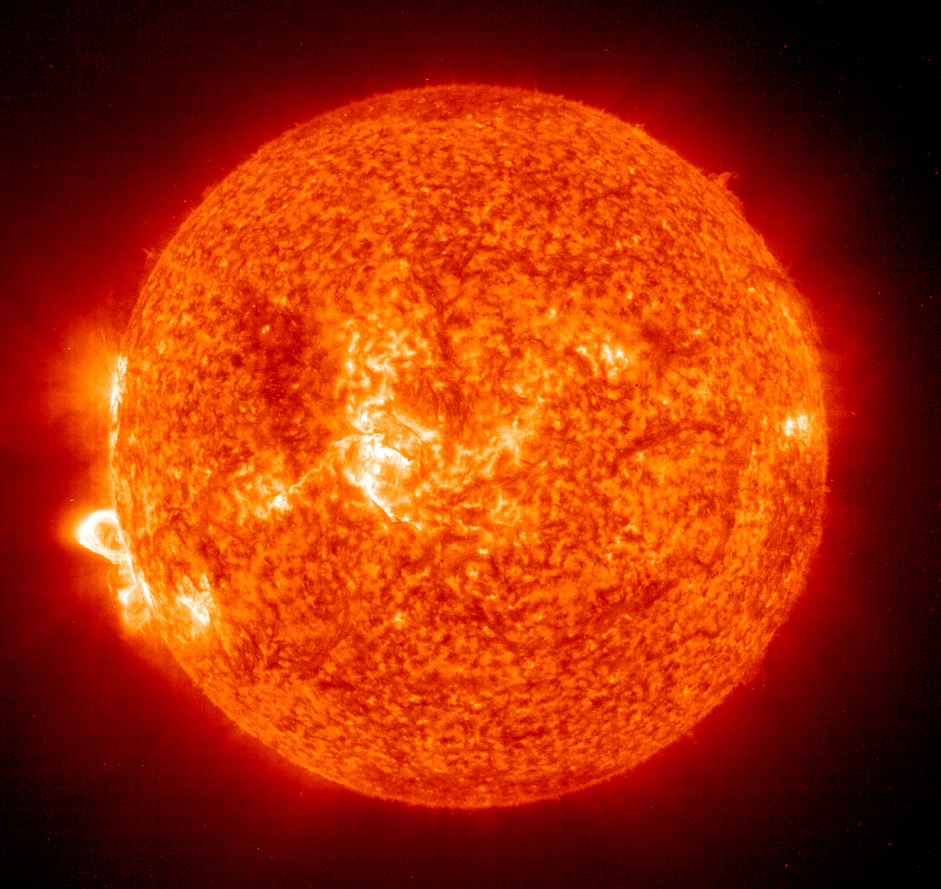 In this handout photo provided by NASA, a Solar and Heliospheric Observatory image shows Region 486 that unleashed a record flare last week (lower left) November 18, 2003 on the sun. The spot itself cannot yet be seen but large, hot, gas-filled loops above this region are visible. These post-flare loops are still active.