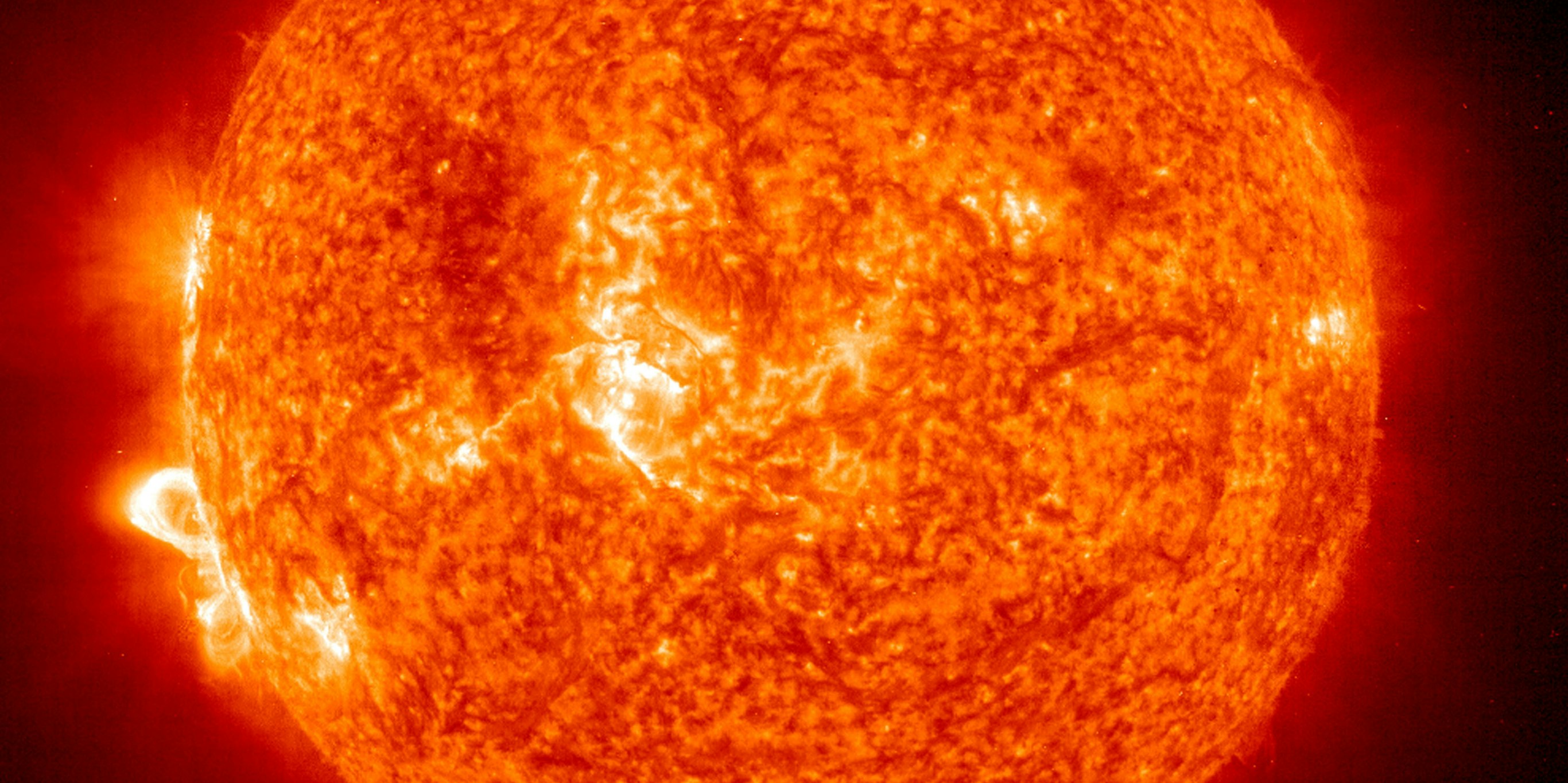 In this handout photo provided by NASA, a Solar and Heliospheric Observatory image shows Region 486 that unleashed a record flare last week (lower left) November 18, 2003 on the sun. The spot itself cannot yet be seen but large, hot, gas-filled loops above this region are visible. These post-flare loops are still active.