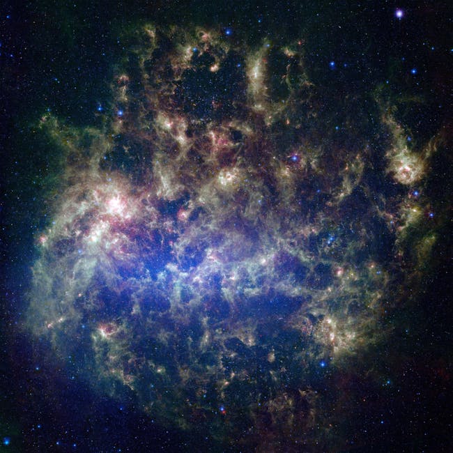 This vibrant image from NASA’s Spitzer Space Telescope shows the Large Magellanic Cloud, a satellite galaxy to our own Milky Way galaxy.