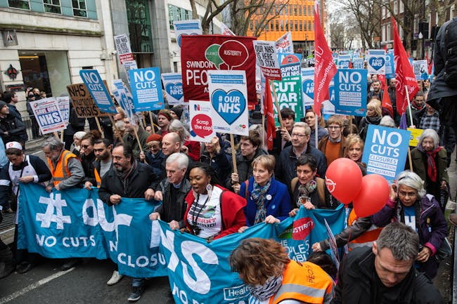LONDON, ENGLAND - MARCH 04: Protesters carry banners and placards through central London during a demonstration in support of the NHS on March 4, 2017 in London, England. Thousands march from Tavistock Square to Parliament today for a demonstration against hospital closures, privatisation and cuts to the NHS. (Photo by Jack Taylor/Getty Images)