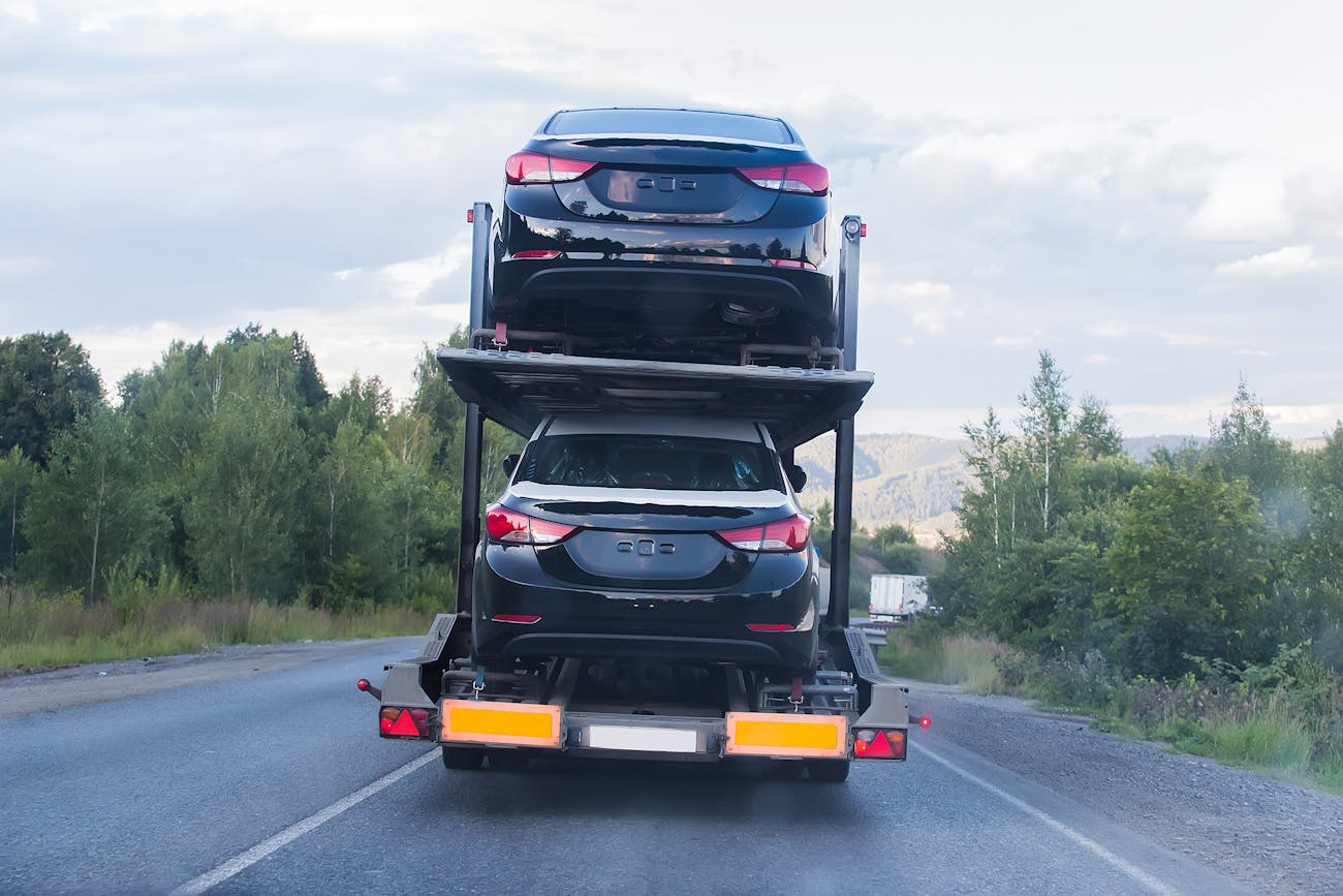 A car carrier making a delivery.