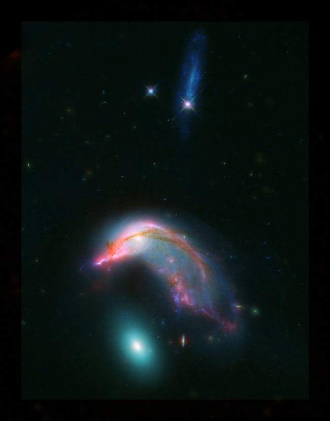 Distant interacting galaxies, known collectively as Arp 142, bears an uncanny resemblance to a penguin guarding an egg. Published by NASA on February 1.