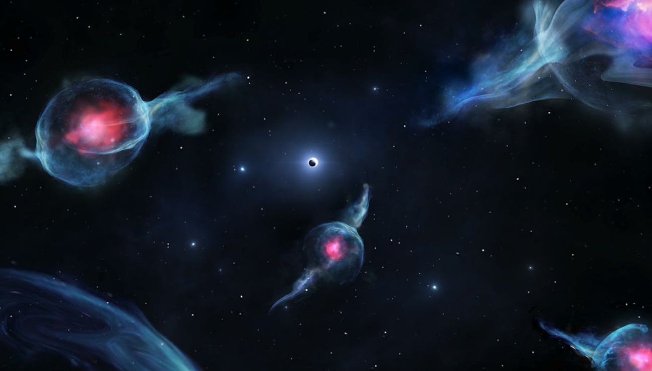 Artist’s impression of G objects, with the reddish centers, orbiting the supermassive black hole at the center of our galaxy. The black hole is represented as a dark sphere inside a white ring (above the middle of the rendering).