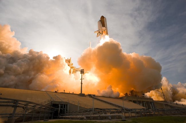 NASA space shuttle lifting off