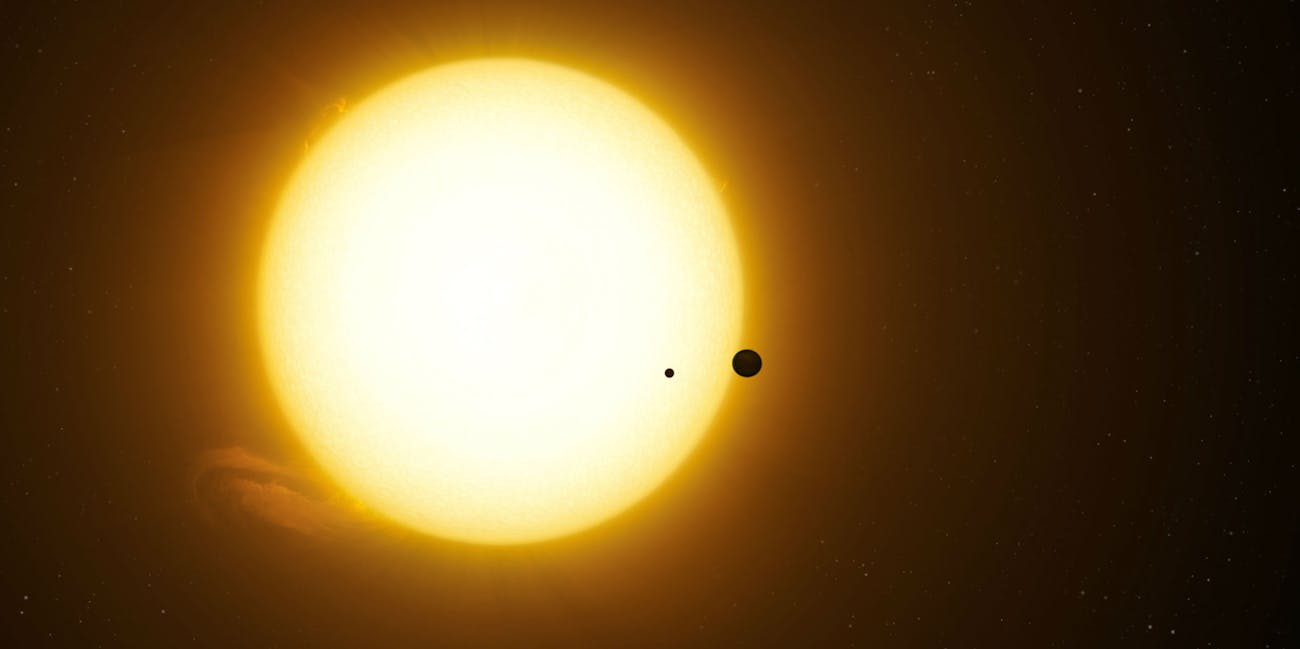 This artist's rendering shows what it may look like for the planet Kepler-1625b and its moon Kepler-1625b-i to pass across the star Kepler-1625.