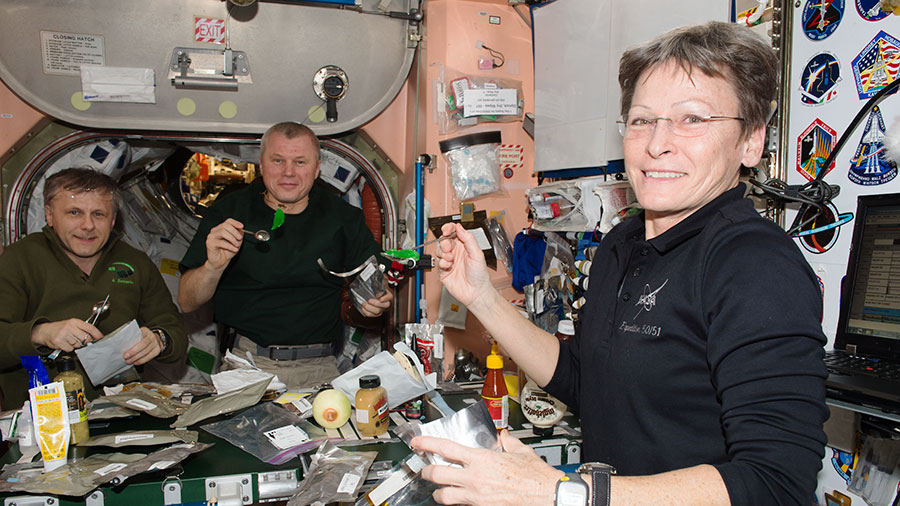 Expedition 50 crewmates (from left) Andrey Borisenko, Oleg Novitskiy and Peggy Whitson at mealtime in Unity module.