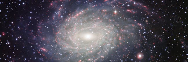 This picture of the nearby galaxy NGC 6744 was taken with the Wide Field Imager on the MPG/ESO 2.2-metre telescope at La Silla. The large spiral galaxy is similar to the Milky Way, making this image look like a picture postcard of our own galaxy sent from extragalactic space.