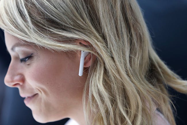 A woman wearing AirPods.
