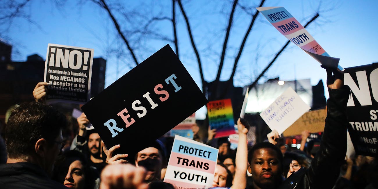 NEW YORK, NY - FEBRUARY 23: Hundreds protest a Trump administration announcement this week that rescinds an Obama-era order allowing transgender students to use school bathrooms matching their gender identities, at the Stonewall Inn on February 23, 2017 in New York City. Activists and members of the transgender community gathered outside the historic LGTB bar to denounce the new policy. (Photo by Spencer Platt/Getty Images)