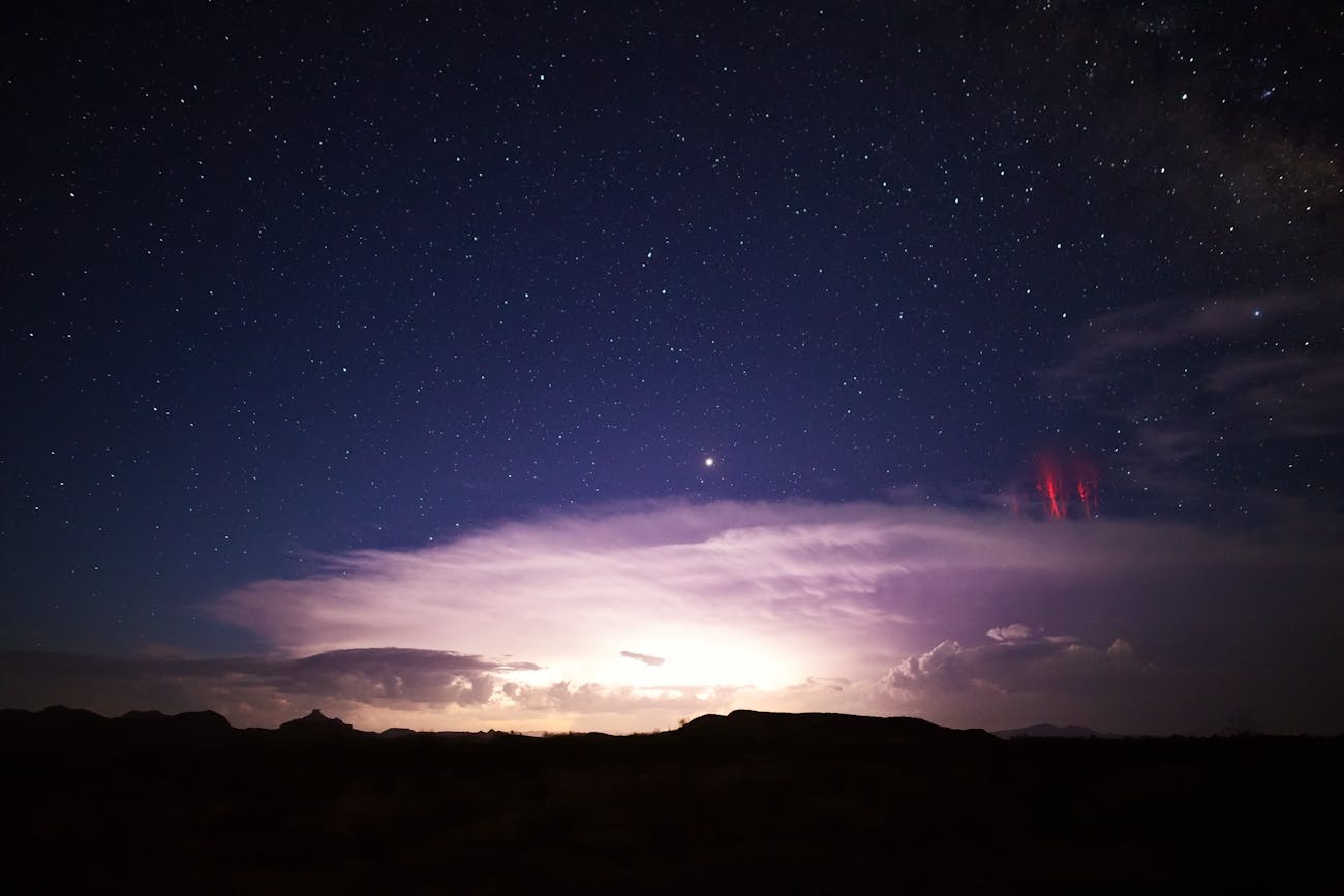 Red sprites (cold plasma lightning) above a powerful thunderstorm.