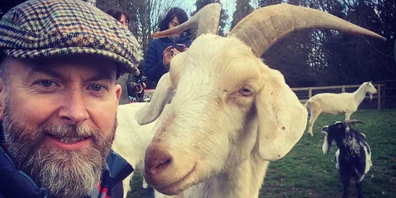 Alan Mcelligott (left) and a goat (right).