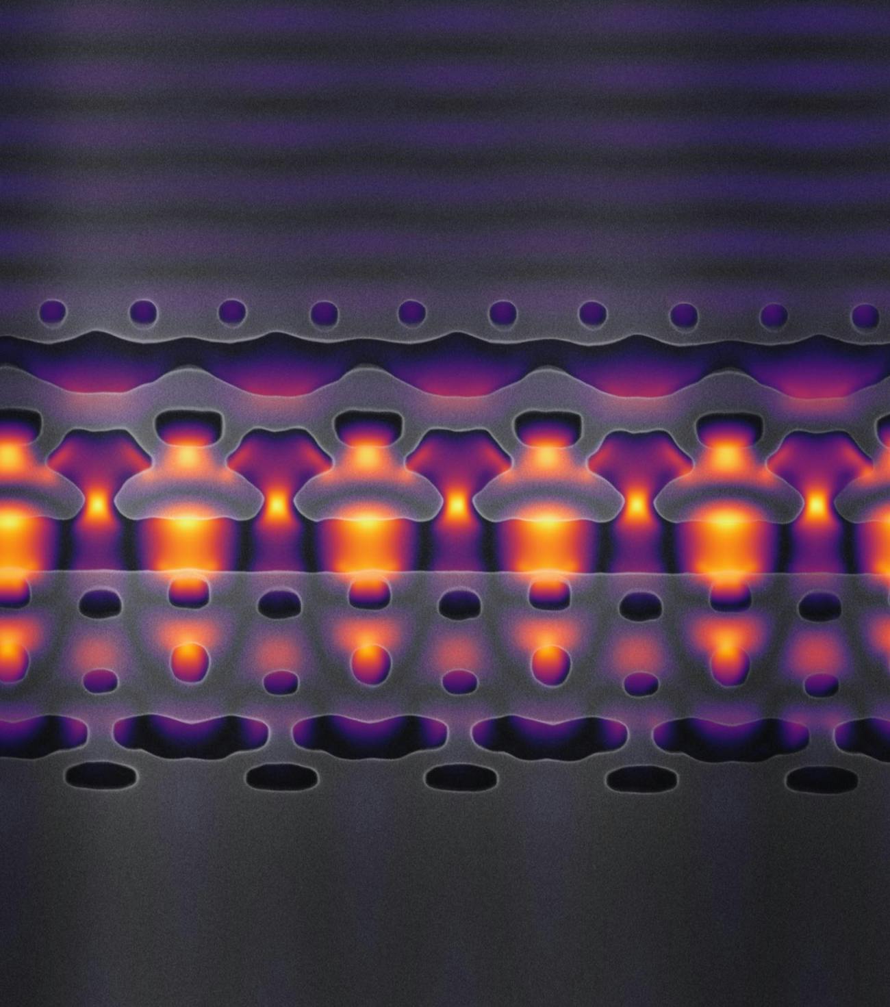 This image (magnified 25,000 times) shows a section of a prototype accelerator-on-a-chip that is one-tenth the width of a human. The Rorschach like curves are carefully etched silicon channels designed to guide the infrared beam.