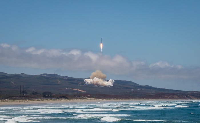 SpaceX launching from a distance.