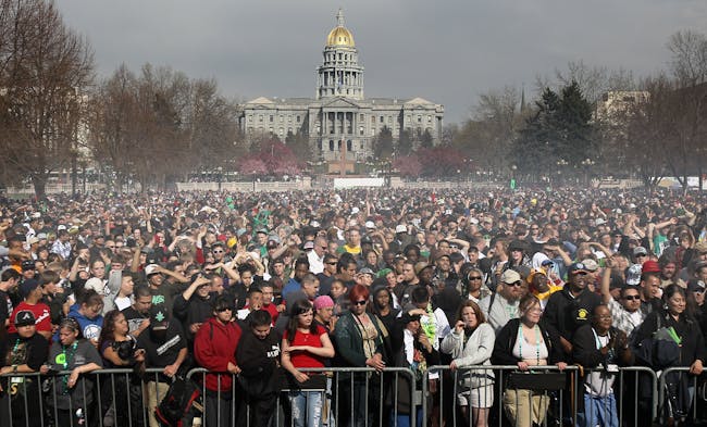 Marijuana smoke rises from a smoking crowd on April 20, 2010, at a pro-pot '4/20' celebration in front of the State Capitol building in Denver, Colorado.