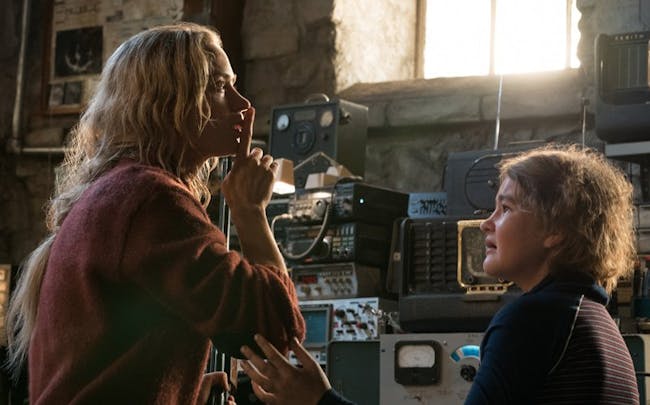 Evelyn Abbot (Emily Blunt) in 'A Quiet Place' next to her daughter Regan (Millicent Simmonds).