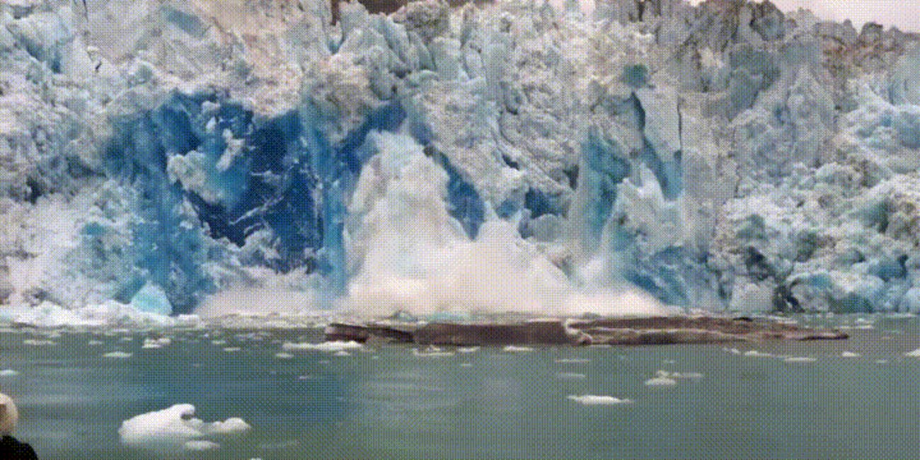 glacial calving ice falling into water antarctica