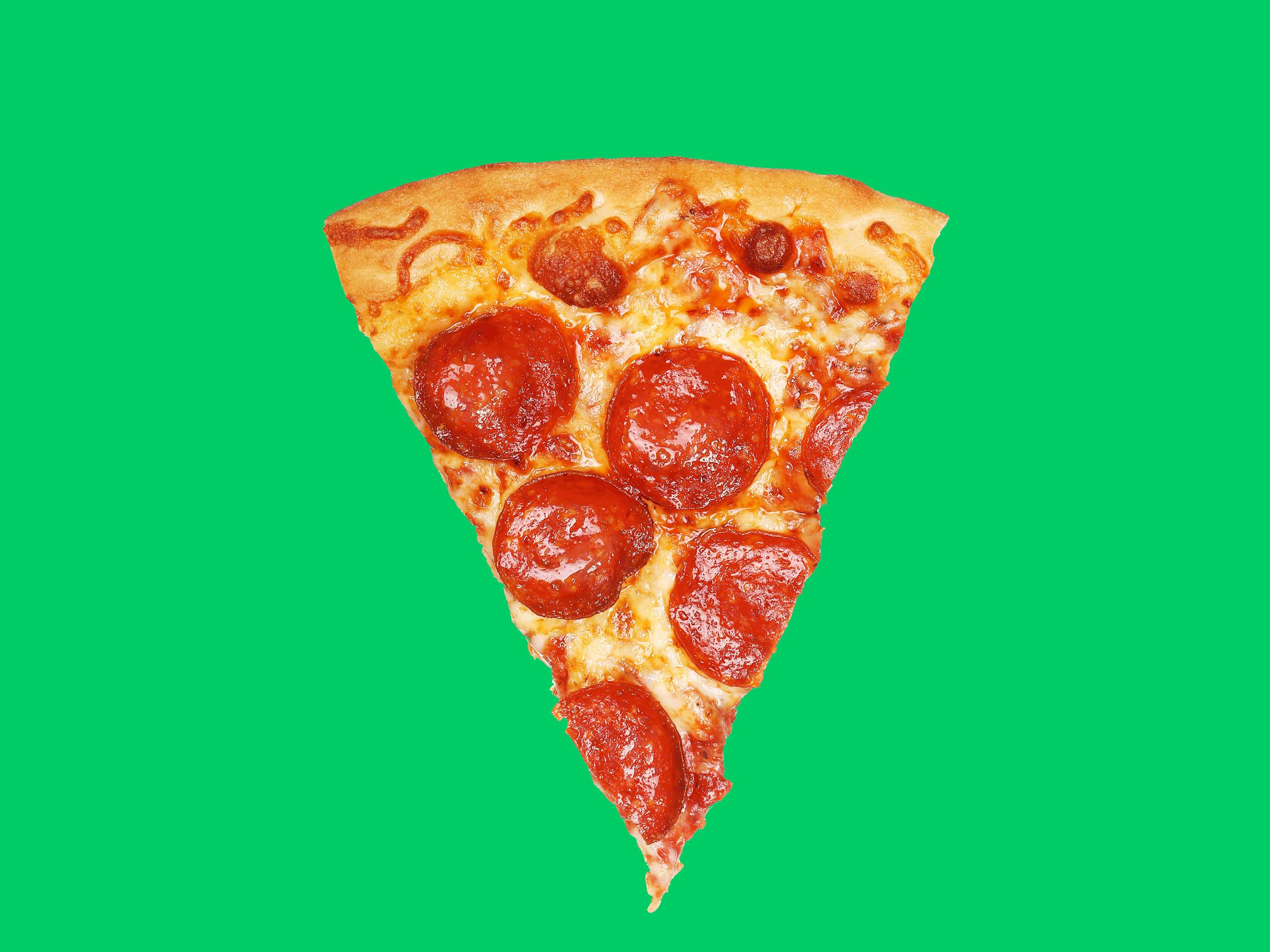 Pepperoni pizza slice on a green background