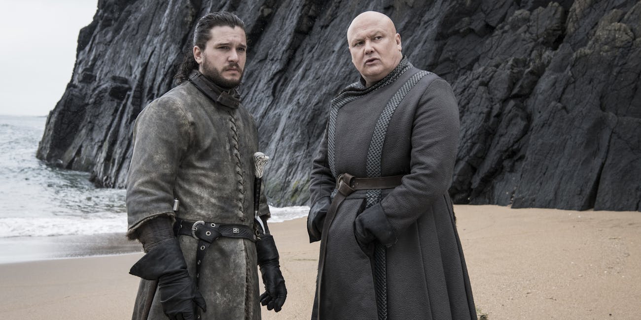 Jon Snow (Kit Harington) and Varys (Conleth Hill) on the beach in 'Game of Thrones'