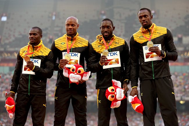 BEIJING, CHINA - AUGUST 30: Gold medalists Nickel Ashmeade of Jamaica, Asafa Powell of Jamaica, Usain Bolt of Jamaica and Nesta Carter of Jamaica pose on the podium during the medal ceremony for the Men's 4x100 Metres Relay final during day nine of the 15th IAAF World Athletics Championships Beijing 2015 at Beijing National Stadium on August 30, 2015 in Beijing, China. (Photo by Patrick Smith/Getty Images)