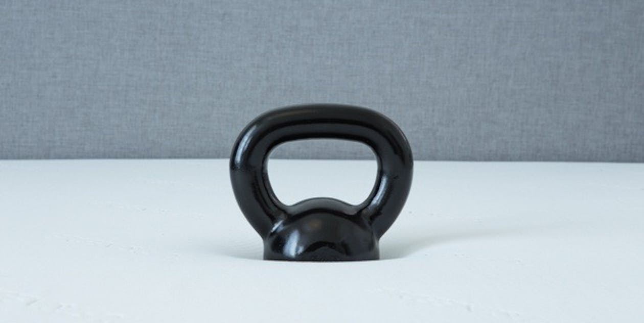 The same 20-pound kettlebell as pictured above on the Leesa, sinking into the Tuft & Needle.