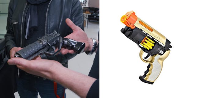 Adam Savage holding the next gen Blade Runner blaster for the Tested YouTube channel.