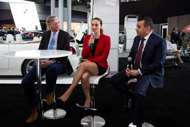 Monika Mikac, center, speaks at the Supercars Forum at the New York Auto Show.