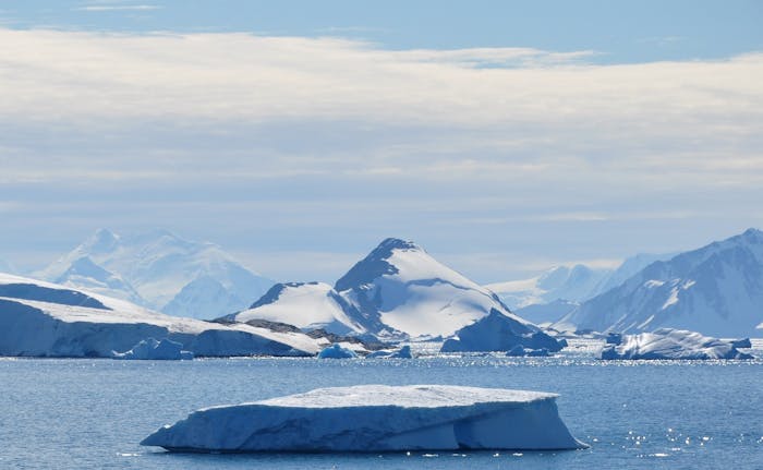 glacial calving ice falling into water antarctica
