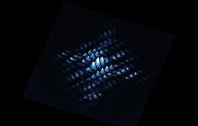 A scanning tunnelling microscope image showing the electron wave function of a qubit made from a phosphorus atom precisely positioned in silicon.