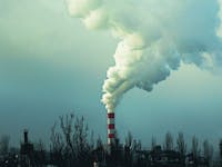 smoke billowing from industrial plant