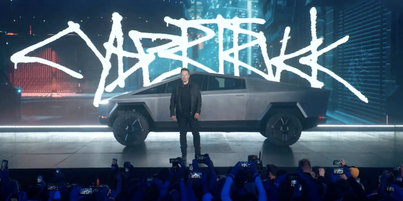 Tesla Cybertruck next to Elon Musk.
