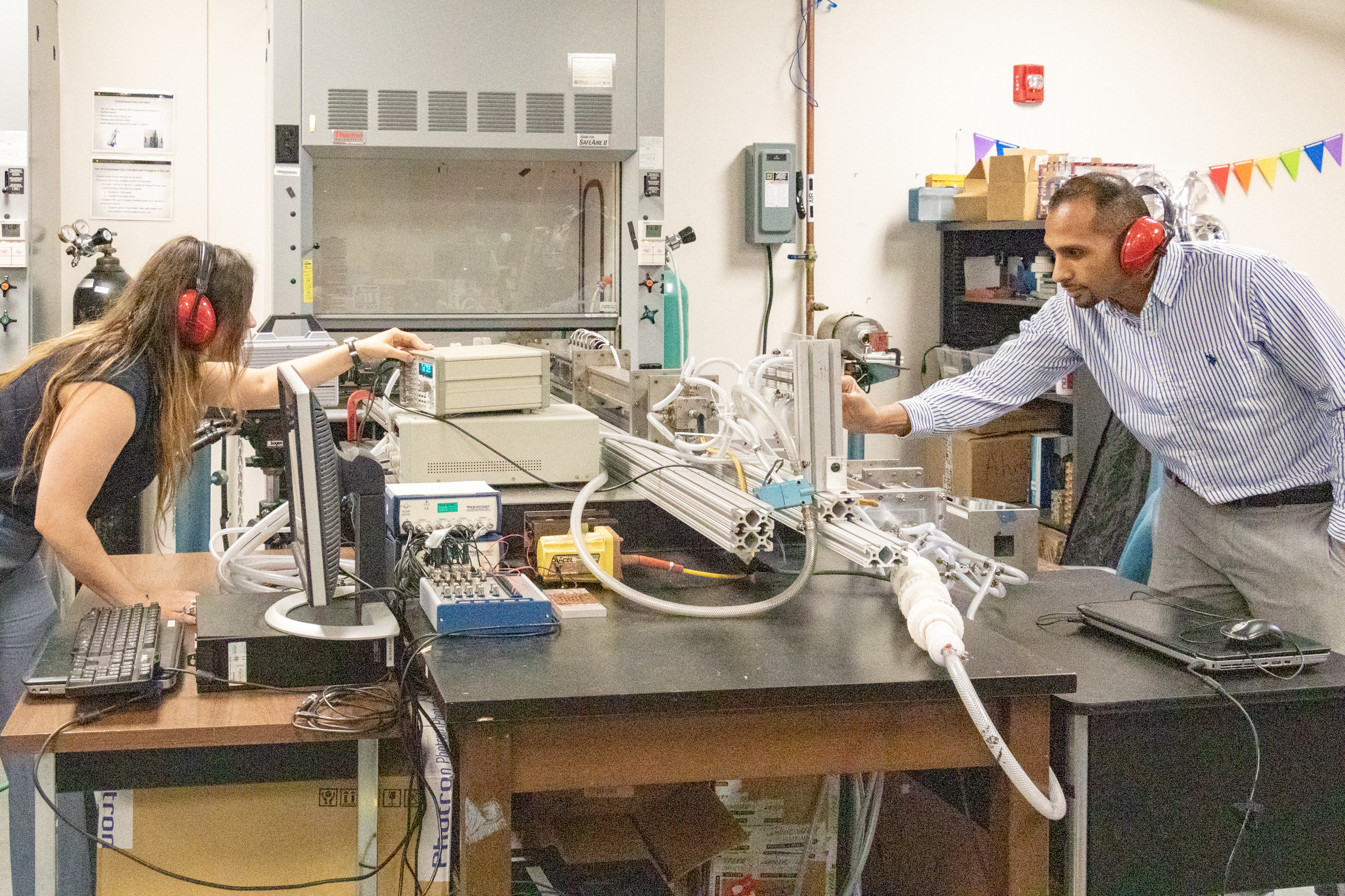 The team behind the recent study test out the mini-detonation in the lab.
