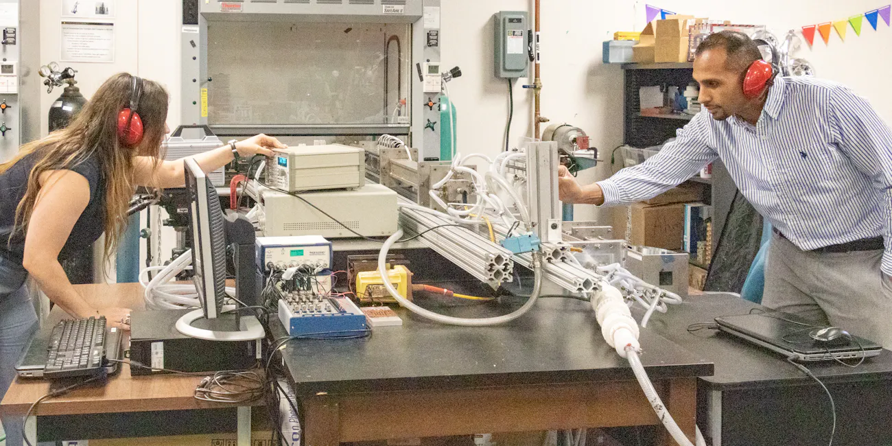 The team behind the recent study test out the mini-detonation in the lab.